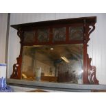 An Arts & Crafts style mahogany overmantel mirror