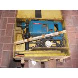 A Bosch hammer drill in case