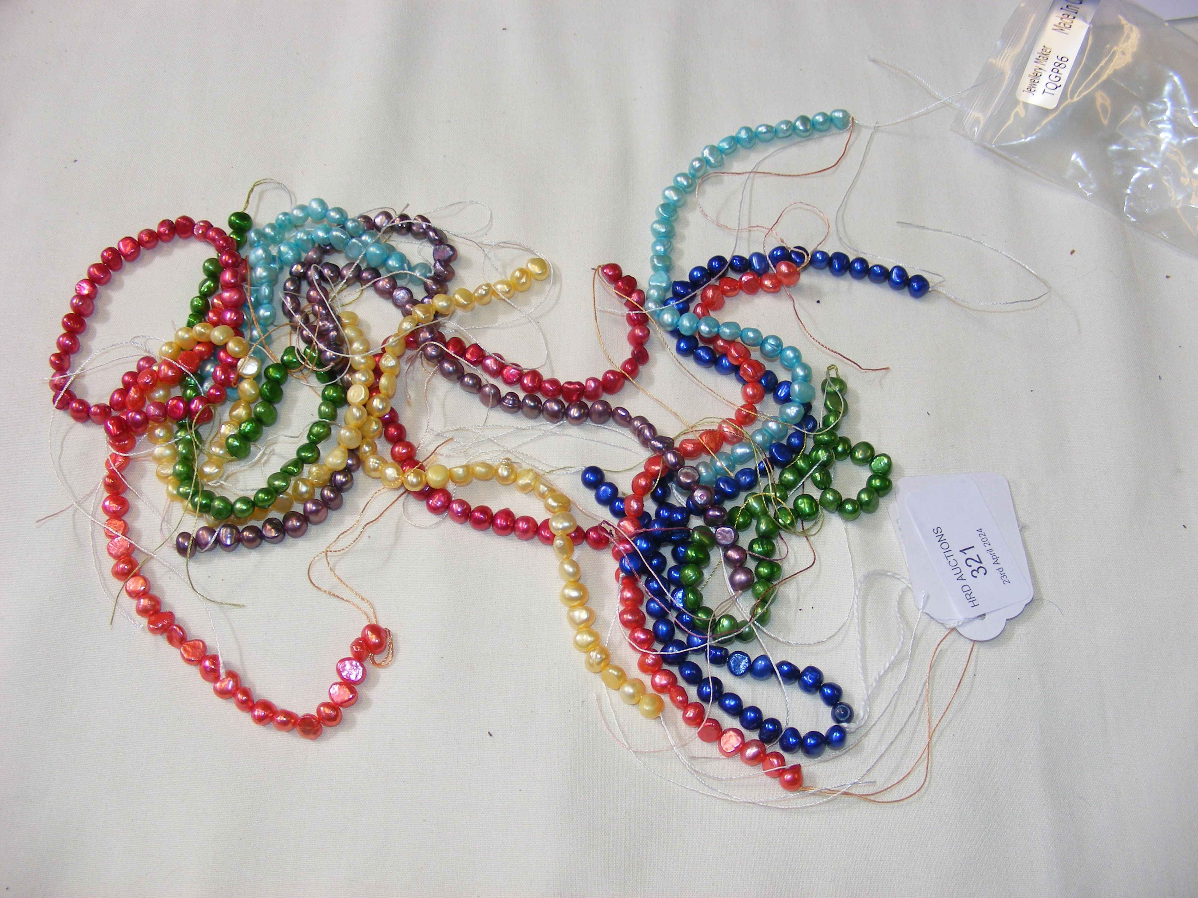Twelve strands of coloured freshwater pearls