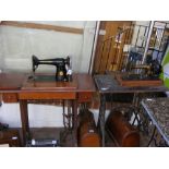 Two Singer sewing machine tables and one other sew