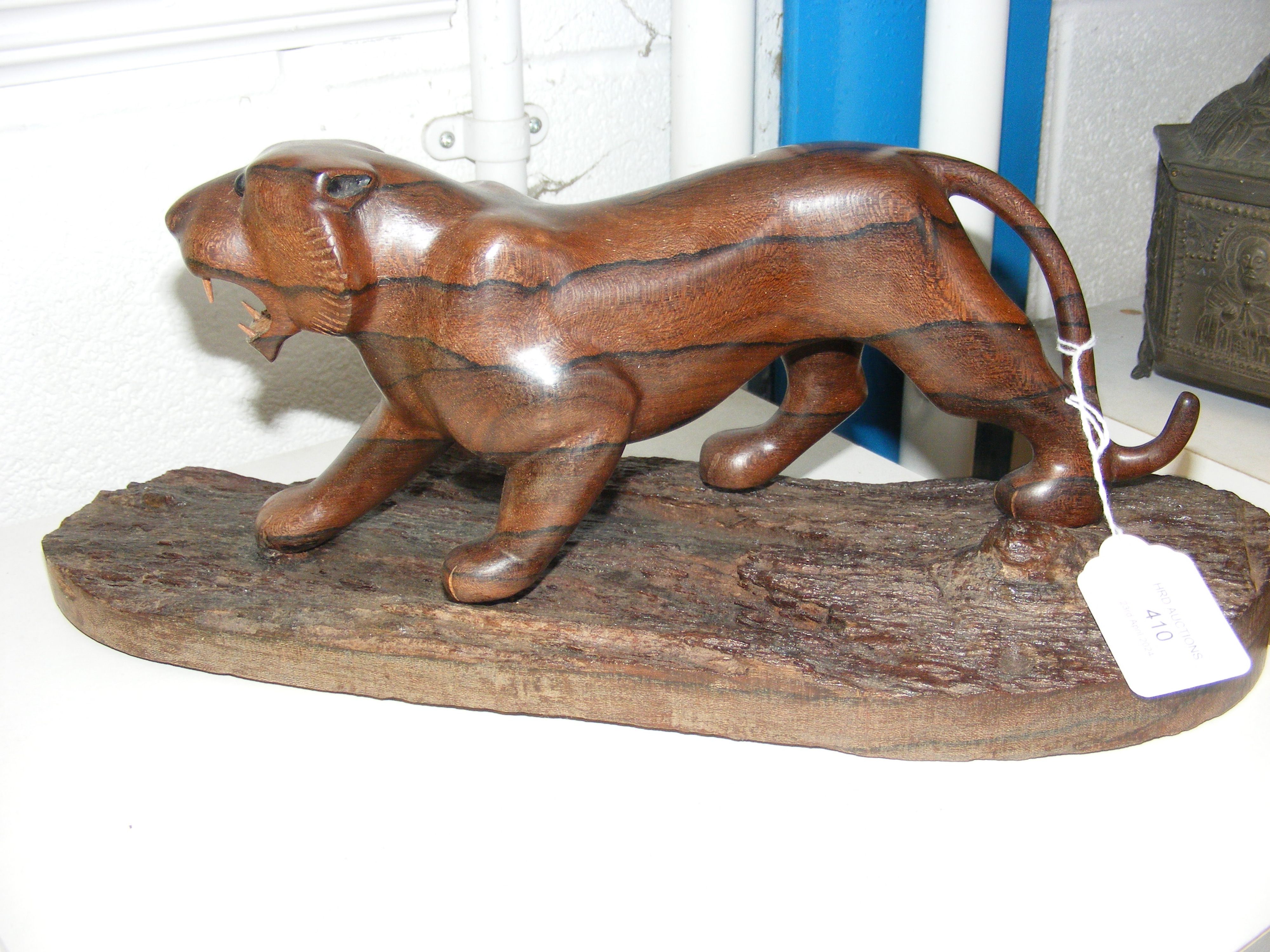 A tropical wood carved big cat