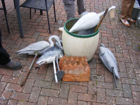 A number of garden Heron ornaments, together with