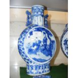 An antique Chinese blue and white moon vase with c