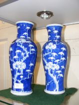 A pair of Chinese baluster vases with floral decor