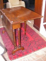 A Victorian mahogany Sutherland table on turned su