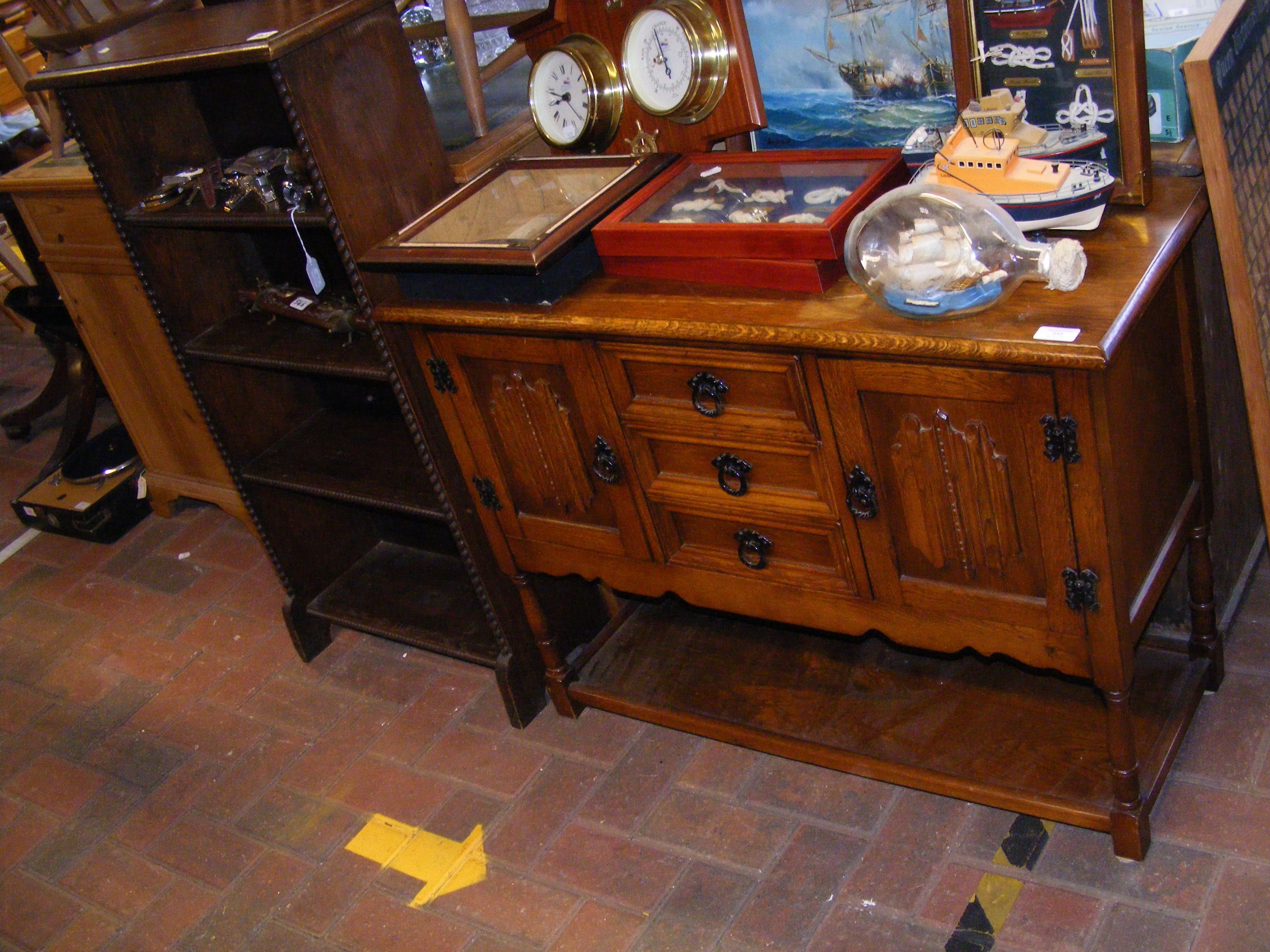 An oak hall cabinet, together with an oak bookcase