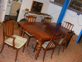 A Victorian style mahogany extending dining table