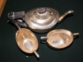 A three piece silver tea set