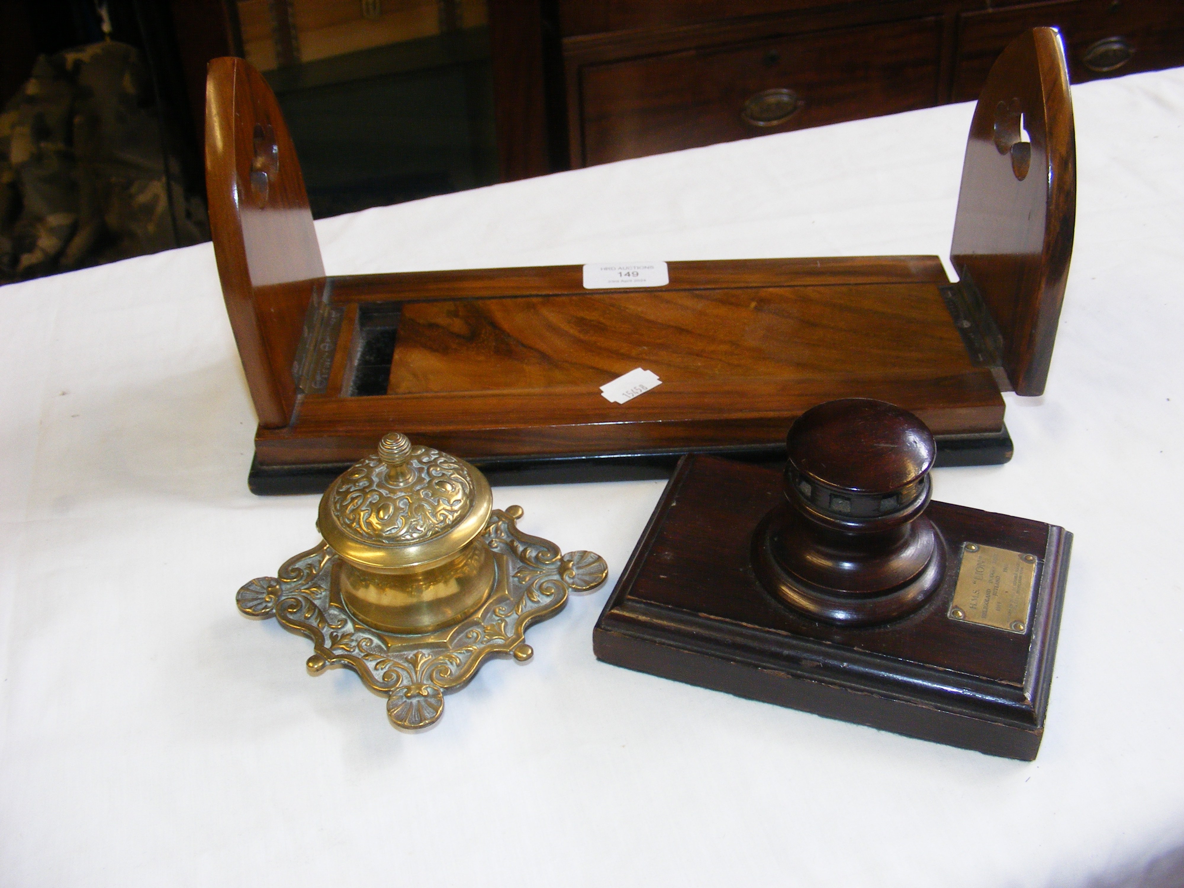 A brass mounted walnut book trough, brass inkwell