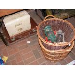 A vintage bread bin, suitcase, two wicker baskets,