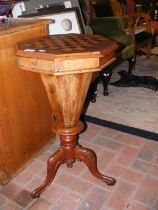 A Victorian work table with checkerboard top and t