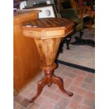 A Victorian work table with checkerboard top and t