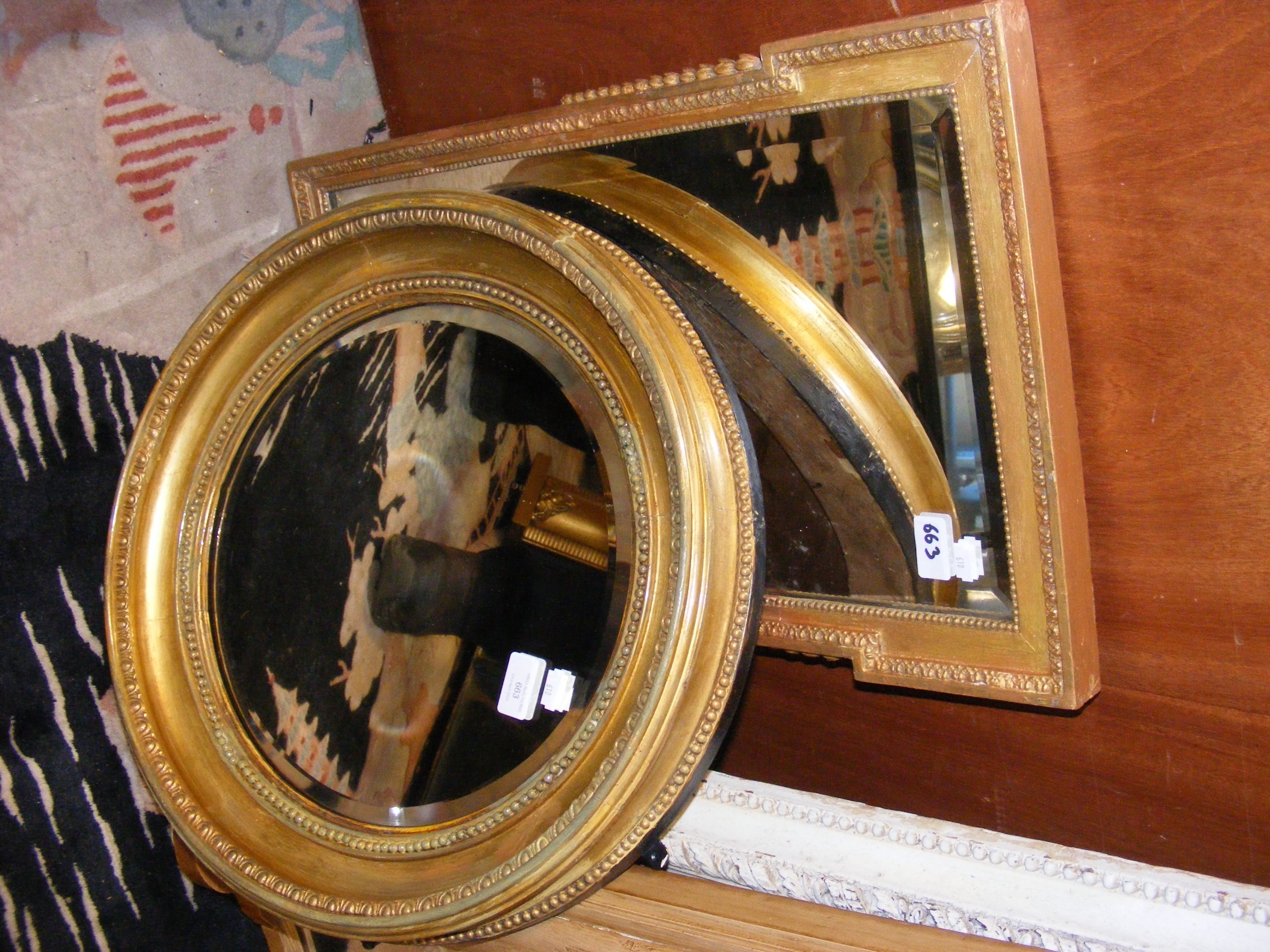 Two Georgian mirrors of varying shape and size