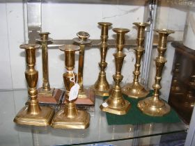 Four pairs of antique candlesticks