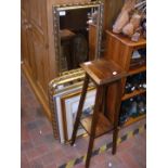 An oak two tier plant stand, two gilt framed mirro