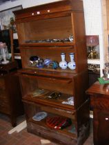 A four tier mahogany sectional bookcase with glaze