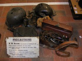 An A W Bombs enamel 'Precautions' sign, gas masks,