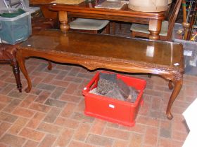 A burr walnut coffee table of cabriole legs