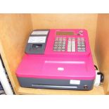 A Casio SE-G1 electronic cash register in hot pink