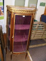 A reproduction French display cabinet on cabriole