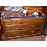 A stripped and waxed chest of three long drawers w