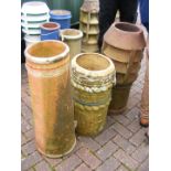 Three chimney pots of varying shape and size