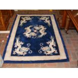 A Chinese rug with dragon design - 185cm x 124cm