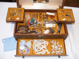 A jewellery box containing costume jewellery inclu
