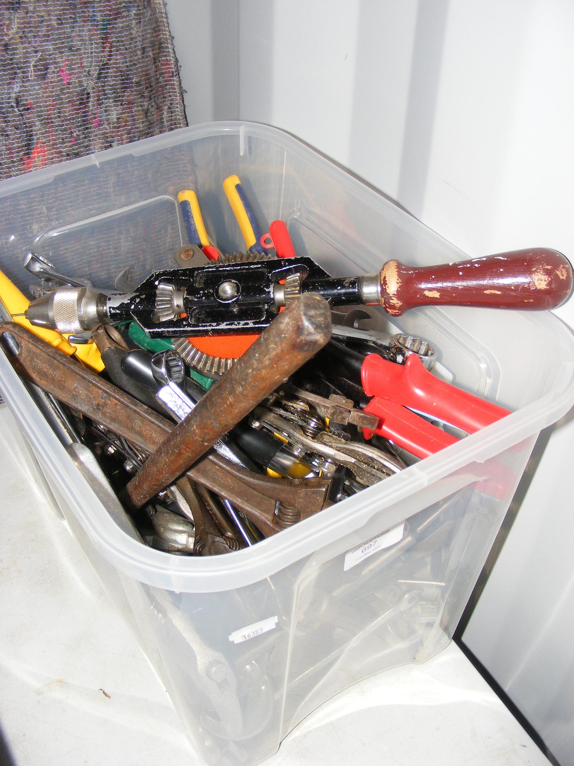 A plastic box containing various useful tools