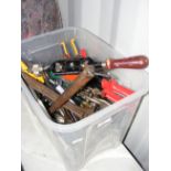 A plastic box containing various useful tools