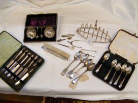 A silver brush, table salts, spoons etc.