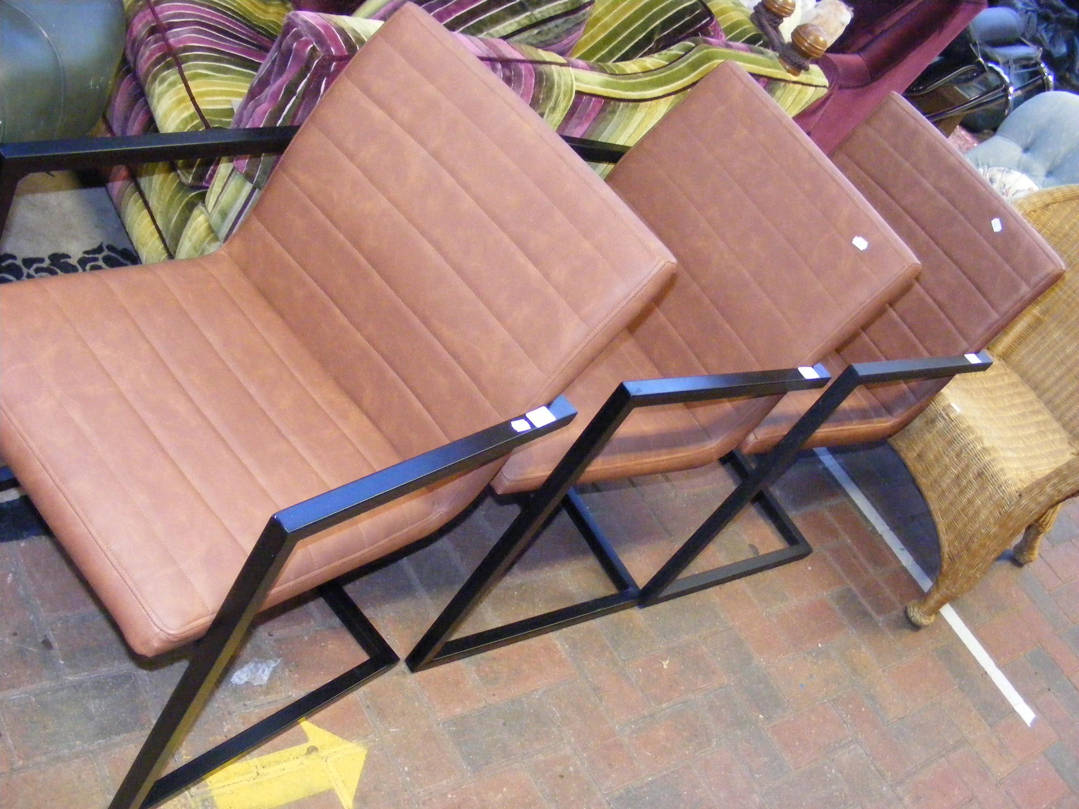 A set of three stylish retro armchairs