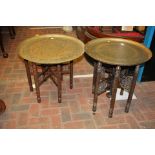 A folding Middle Eastern brass top table and one o