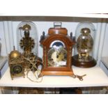 Two domed Skeleton clocks, together with a moon cl