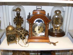 Two domed Skeleton clocks, together with a moon cl