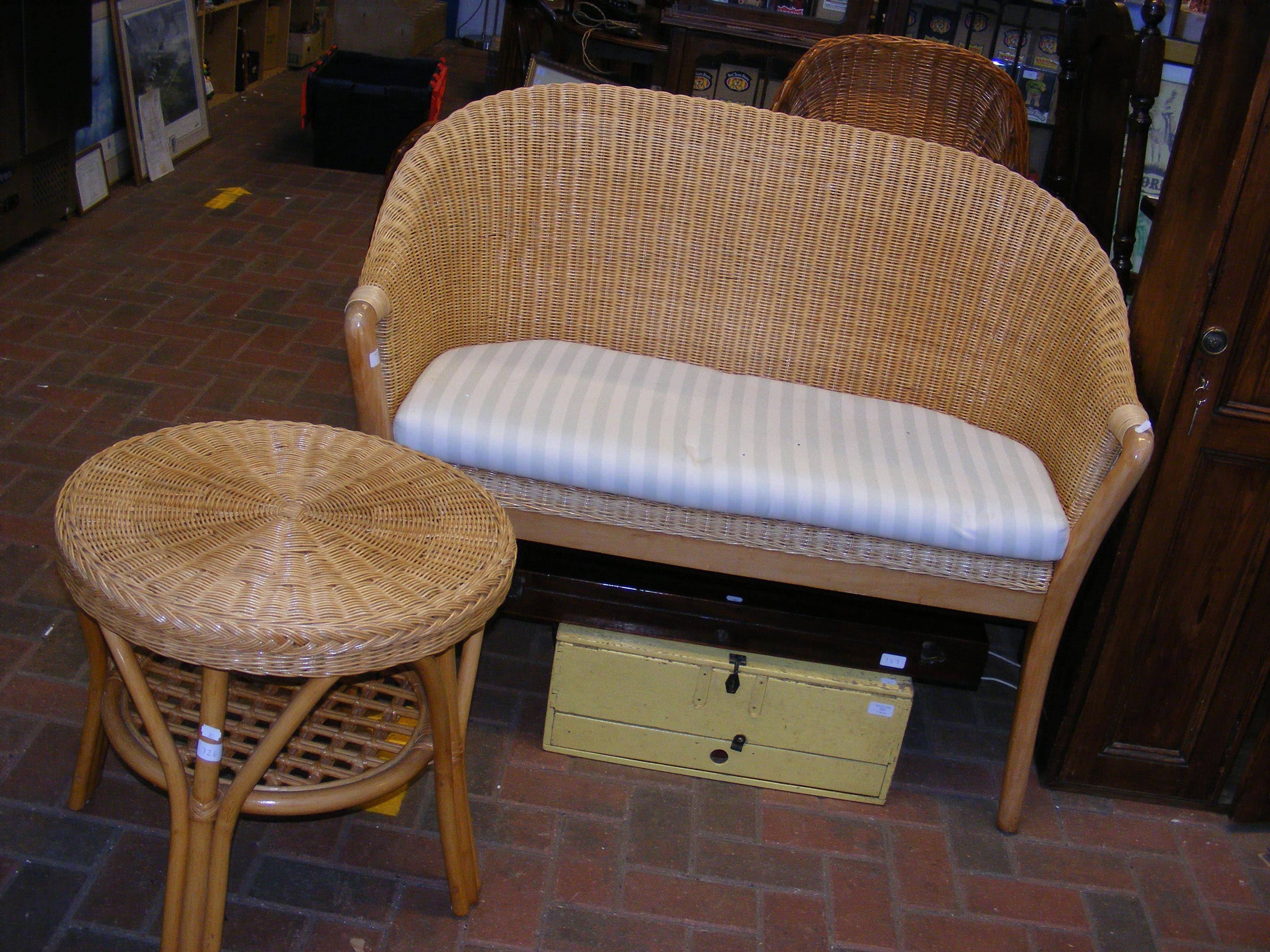 A cane two seater conservatory chair, together wit