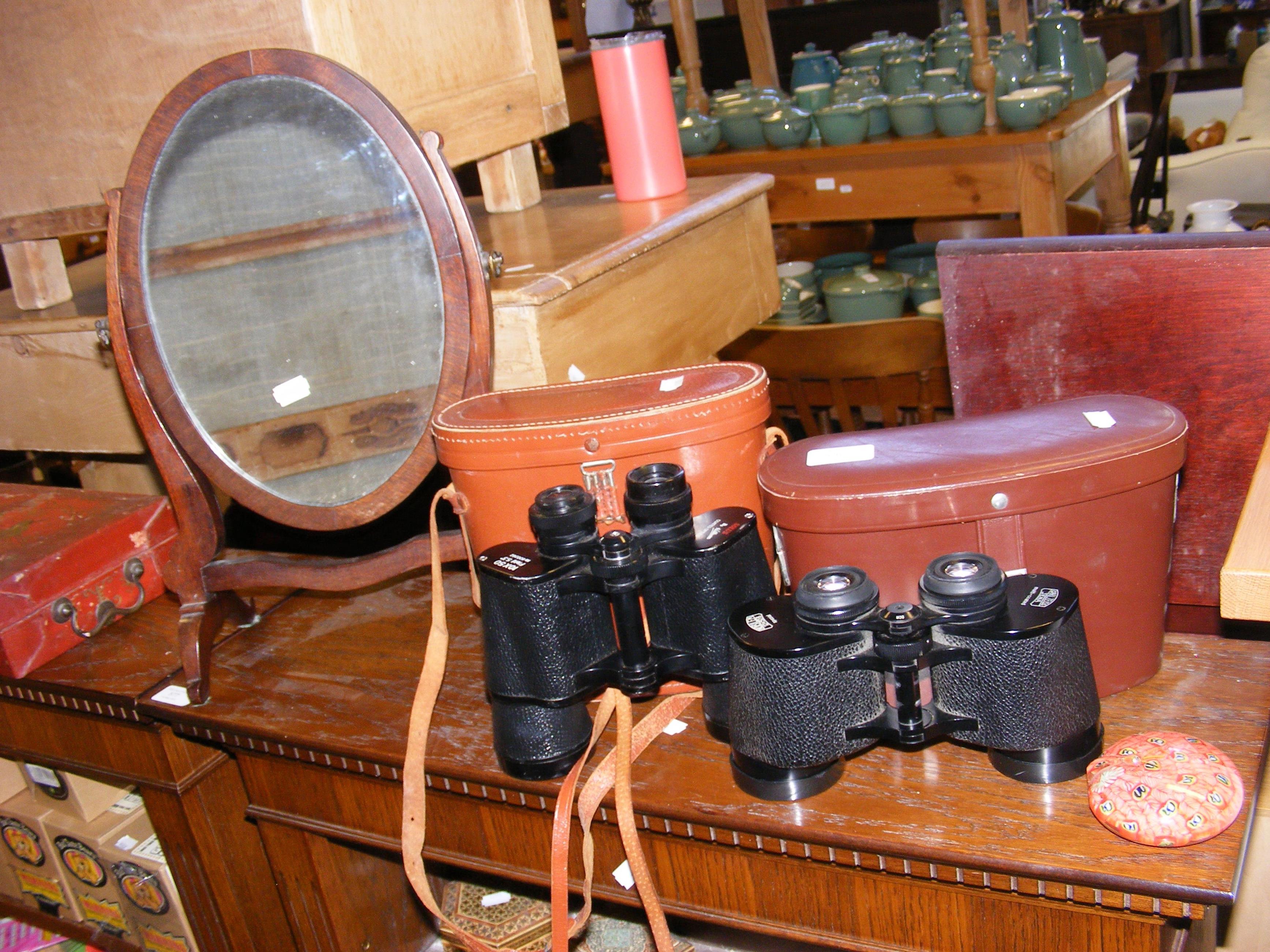 Two pairs of vintage binoculars, an oval toilet mi