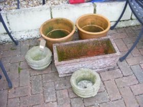 A pair of terracotta garden pots, together with tr