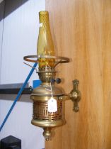 An antique gimbled ship wall oil lamp