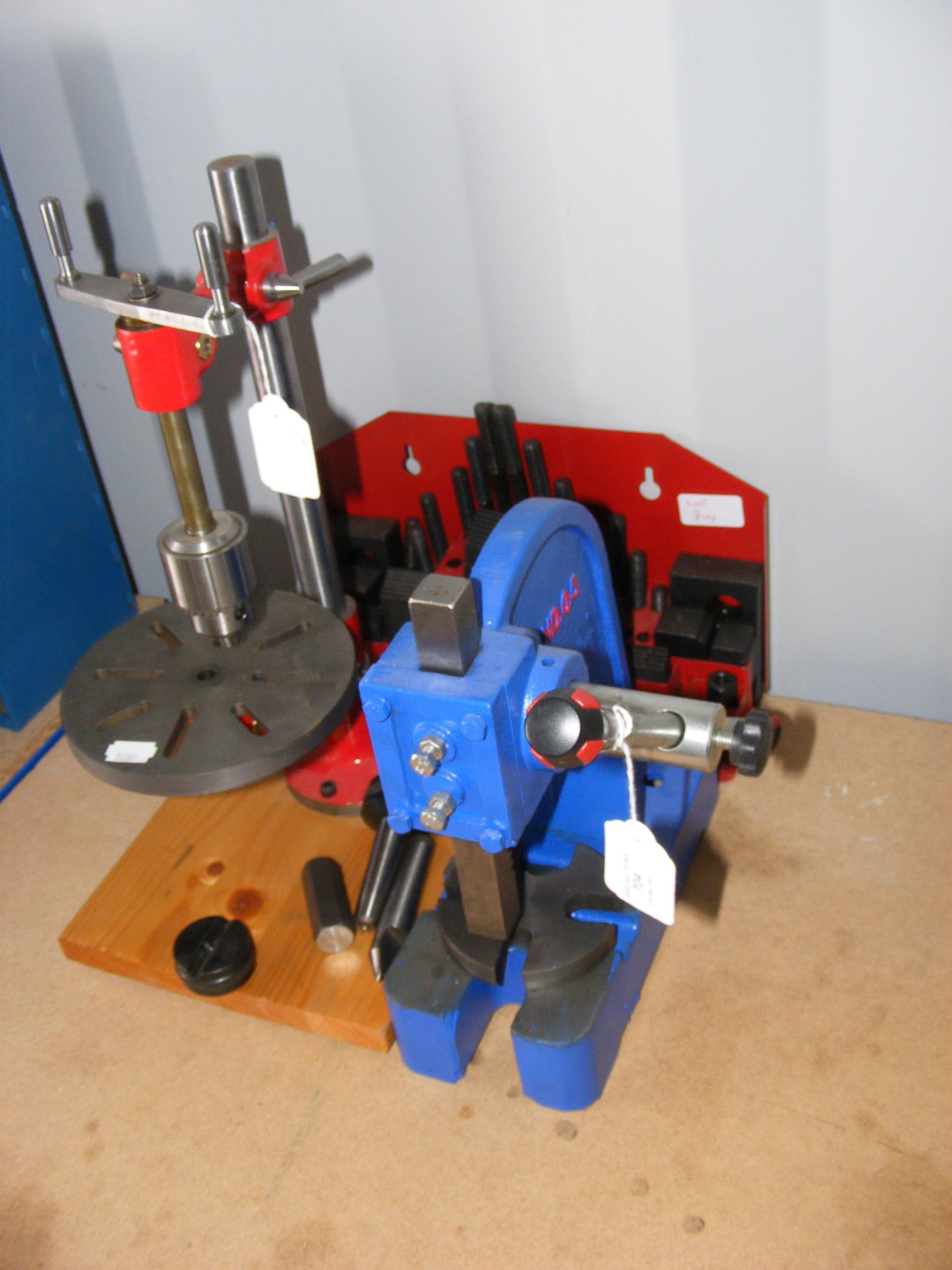 A hand drill and press, together with tools