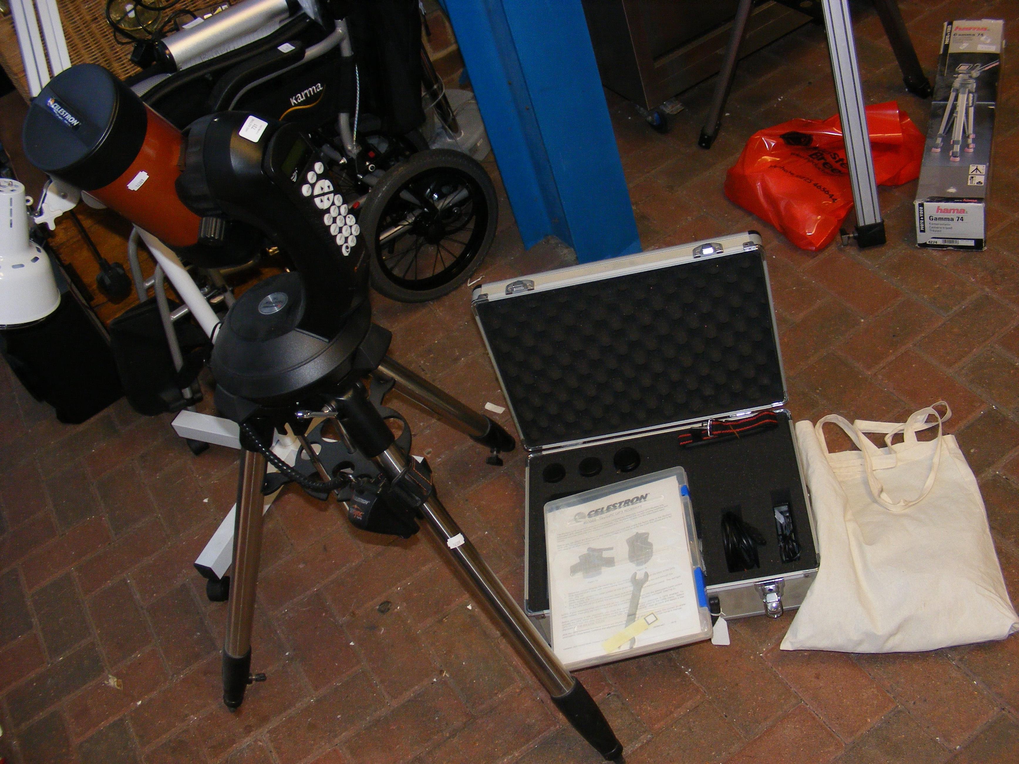 A Celestron NexStar SE telescope on stand with acc