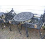 A black and metal bistro garden table with two cha