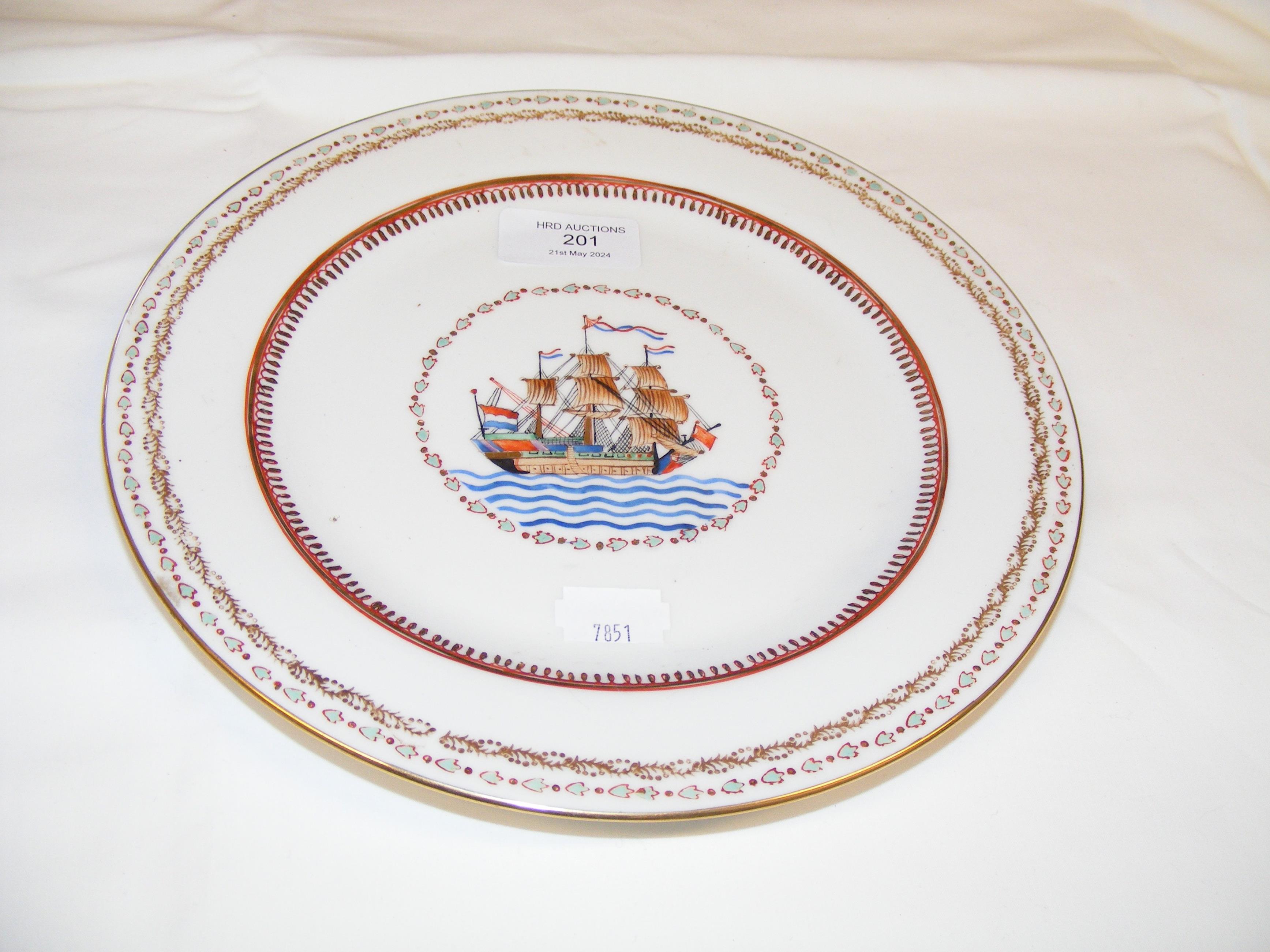 An antique Chinese armorial plate depicting three