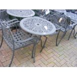 A black and metal bistro garden table with two cha