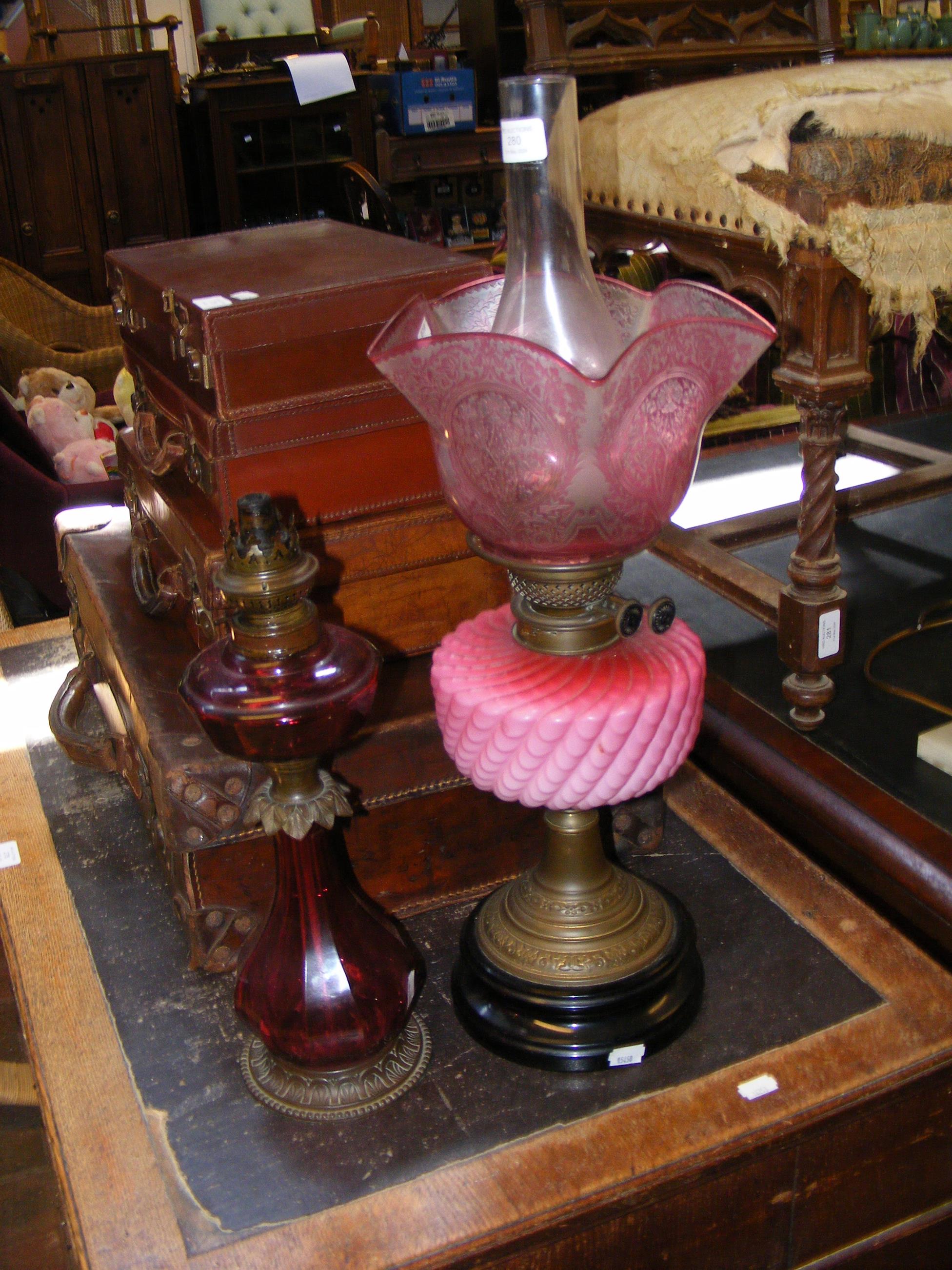 An antique oil lamp and one other