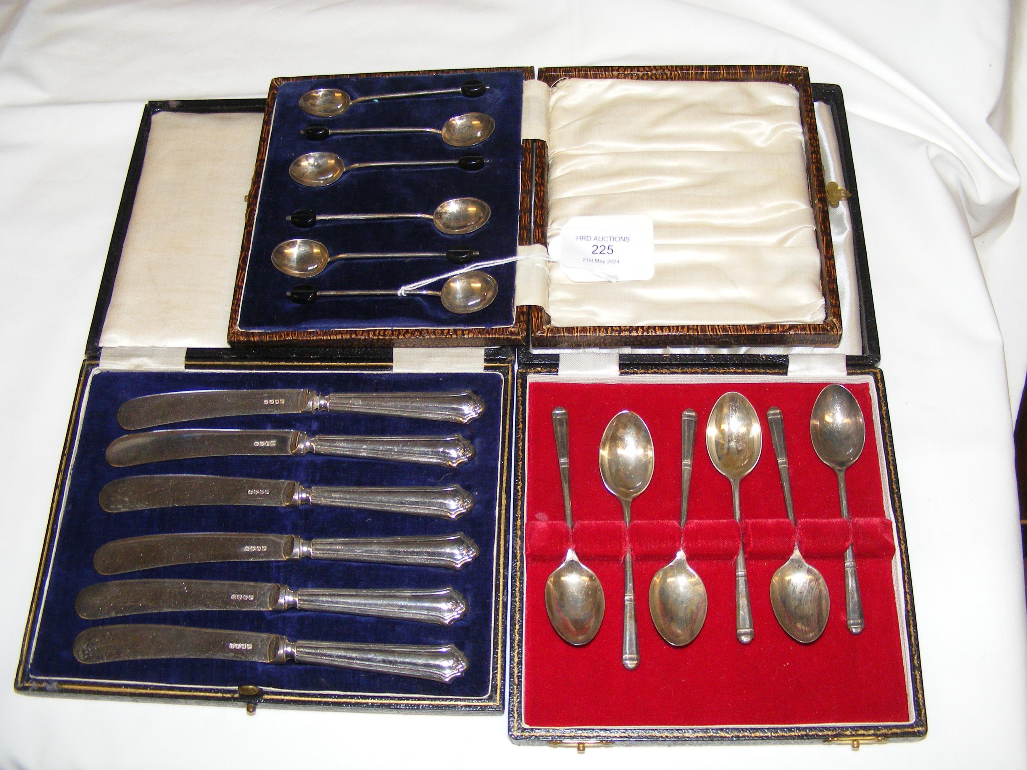 Silver teaspoons, cased bread knives