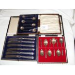 Silver teaspoons, cased bread knives