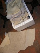 A box of leatherette upholstering pieces