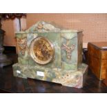 An antique onyx mantel clock with visible escapeme