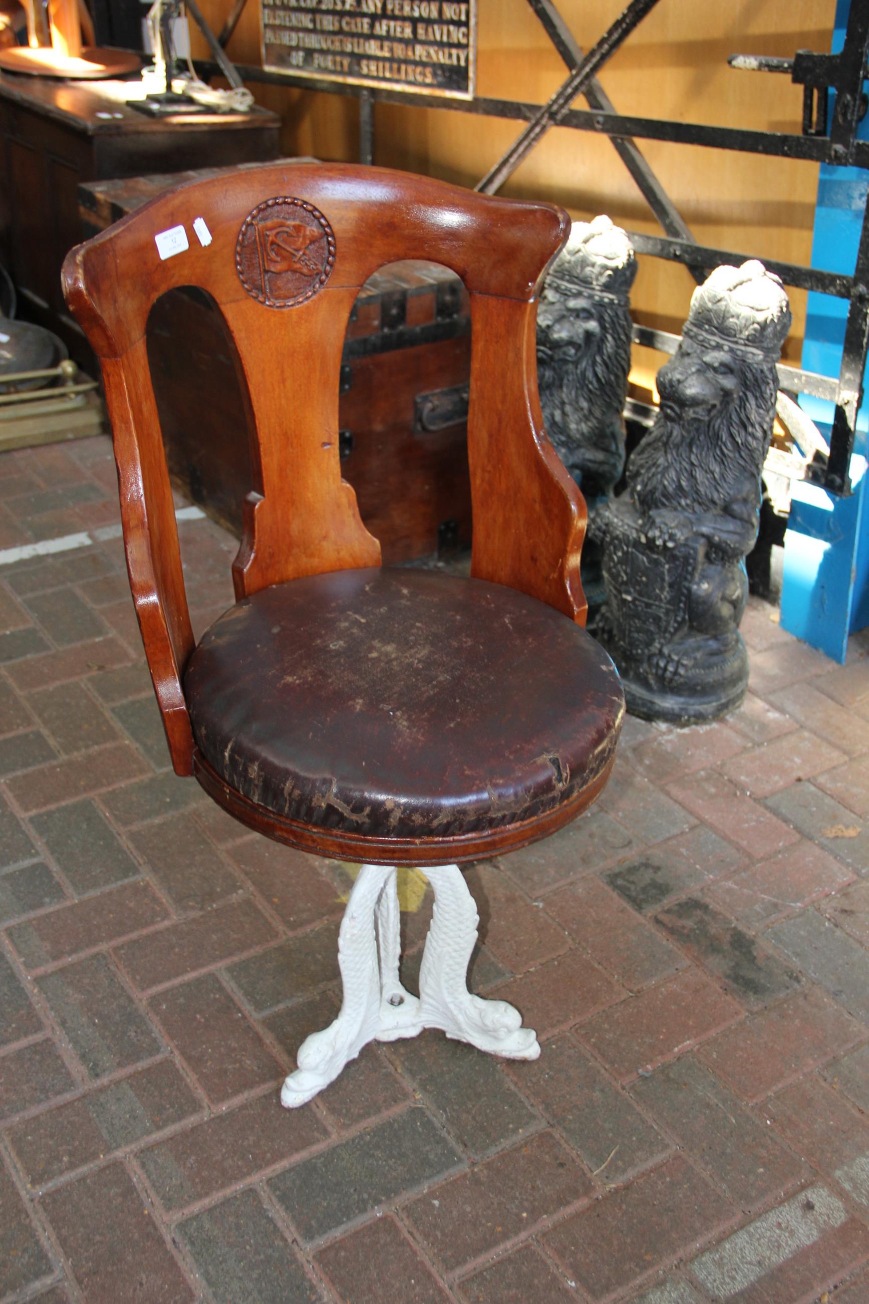 An antique 'Anchor Line' ship's chair with curved